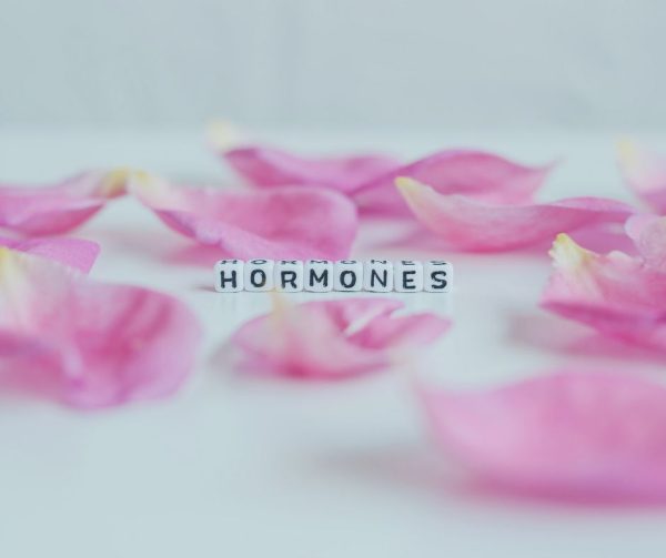 Hormones spelled in tiles with flower petals