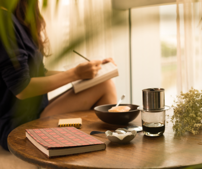 woman journaling to reduce stress