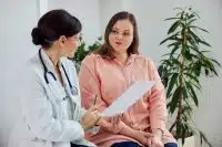 woman talking to doctor