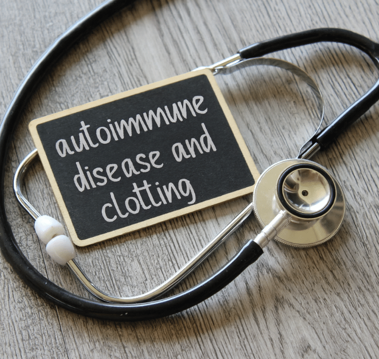 sign that reads "autoimmune disease and clotting" that is draped by a stethoscope