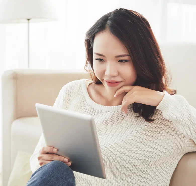 woman reading a tablet device
