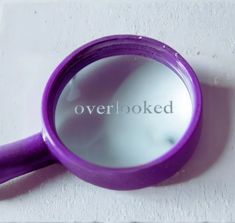 purple magnifying glass over the word 'overlooked'