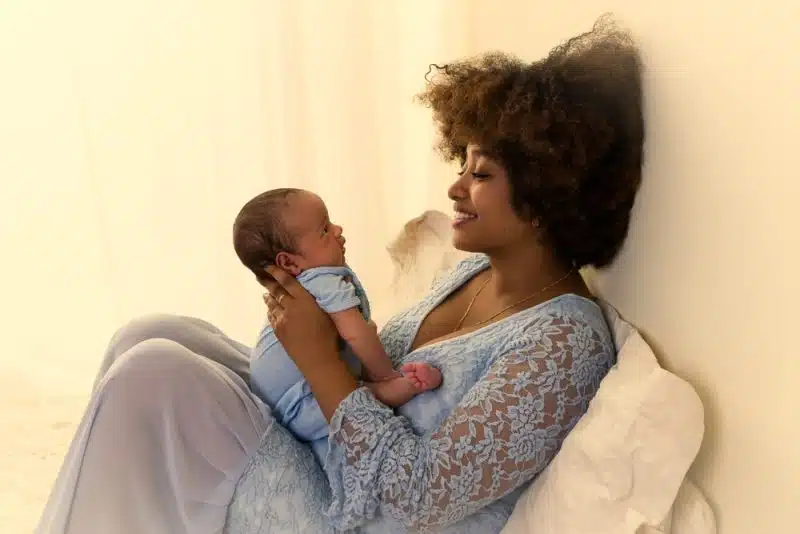 Beautiful,Young,African,Mother,In,A,Blue,Lace,Dress,Bonding
