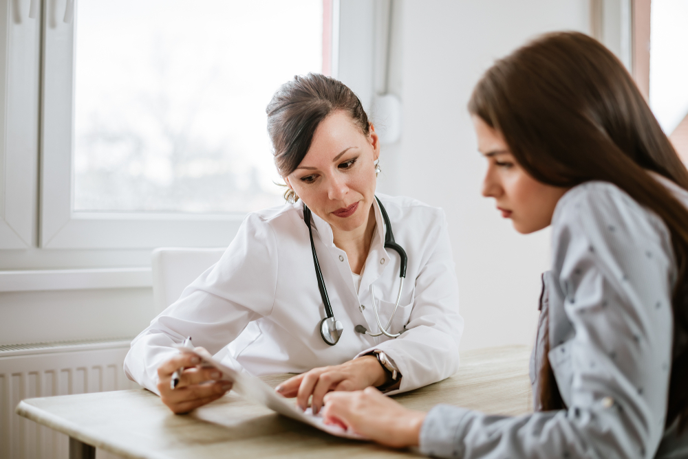 female doctor consulting with female patient